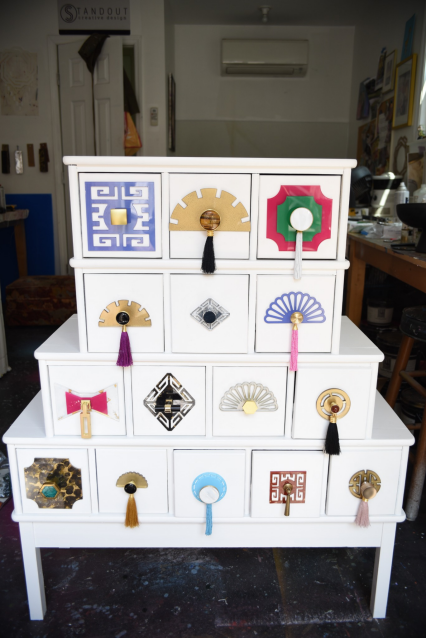 Showcasing interchangeable backplates on a Facebook Marketplace dresser.